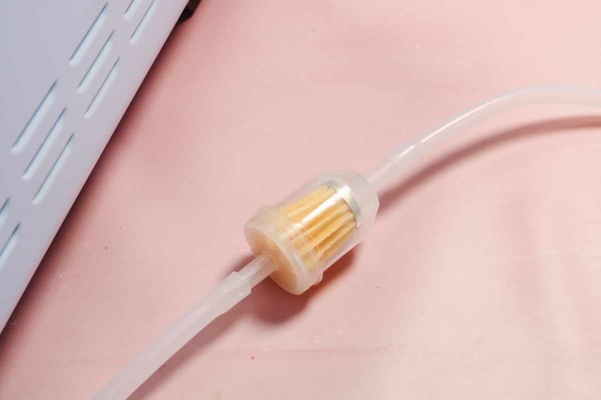 Vacuum hose and filter.