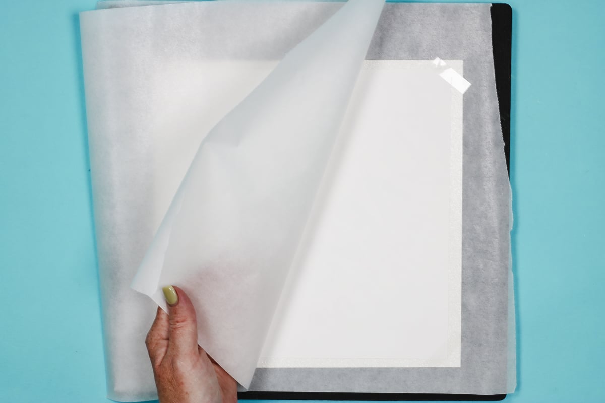 Add protective paper to top and bottom of glitter cardstock.