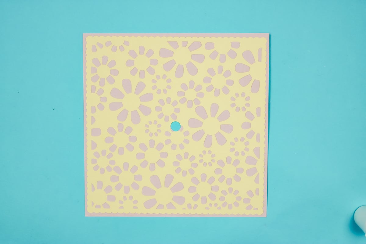 Add floral layer to base layer lining up center hole.