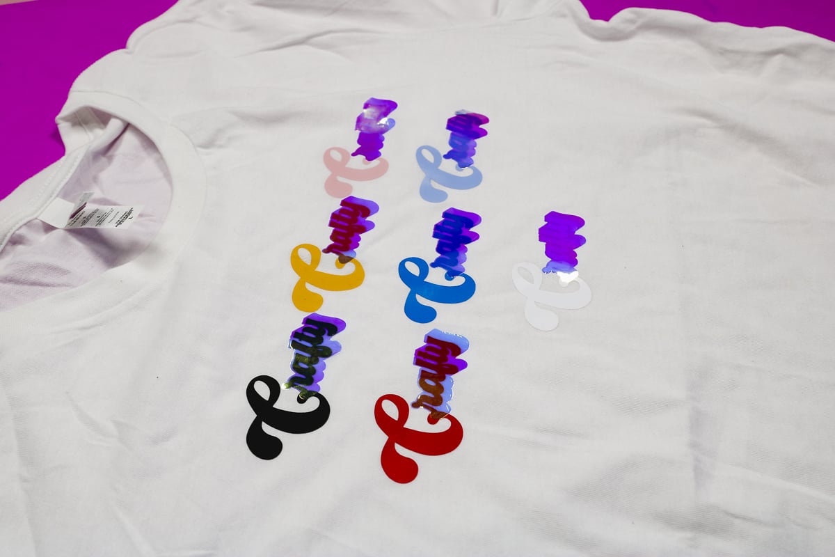 Holographic pearl HTV on white shirt.