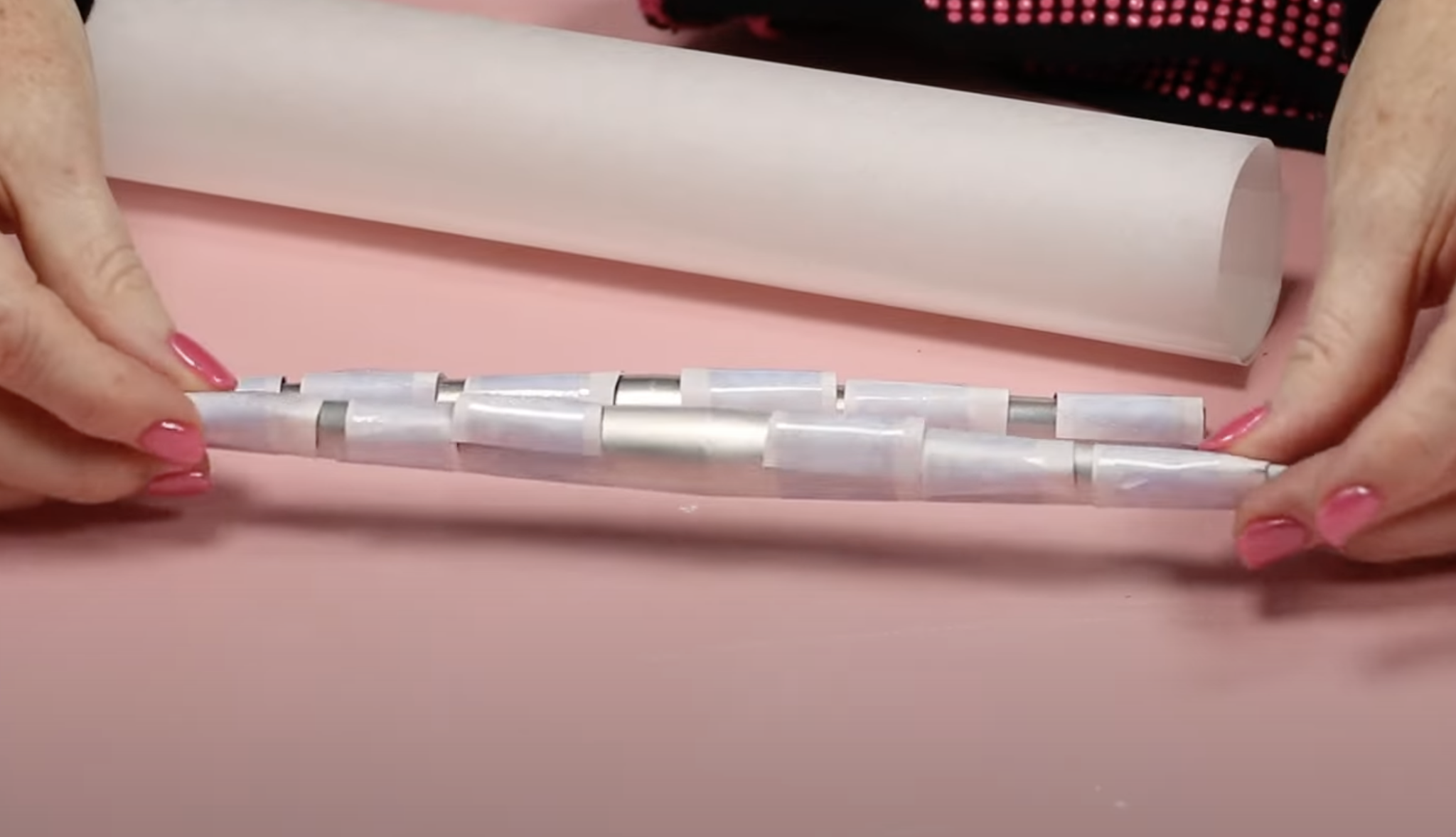 Tape sublimation print onto nail on nail form.