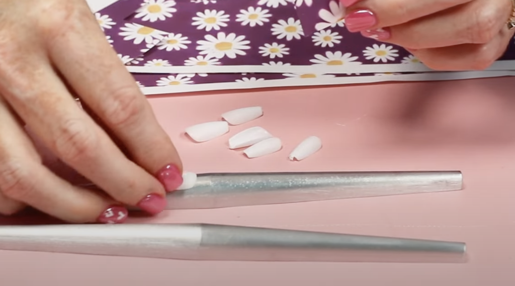 Place nails snuggly on nail form.