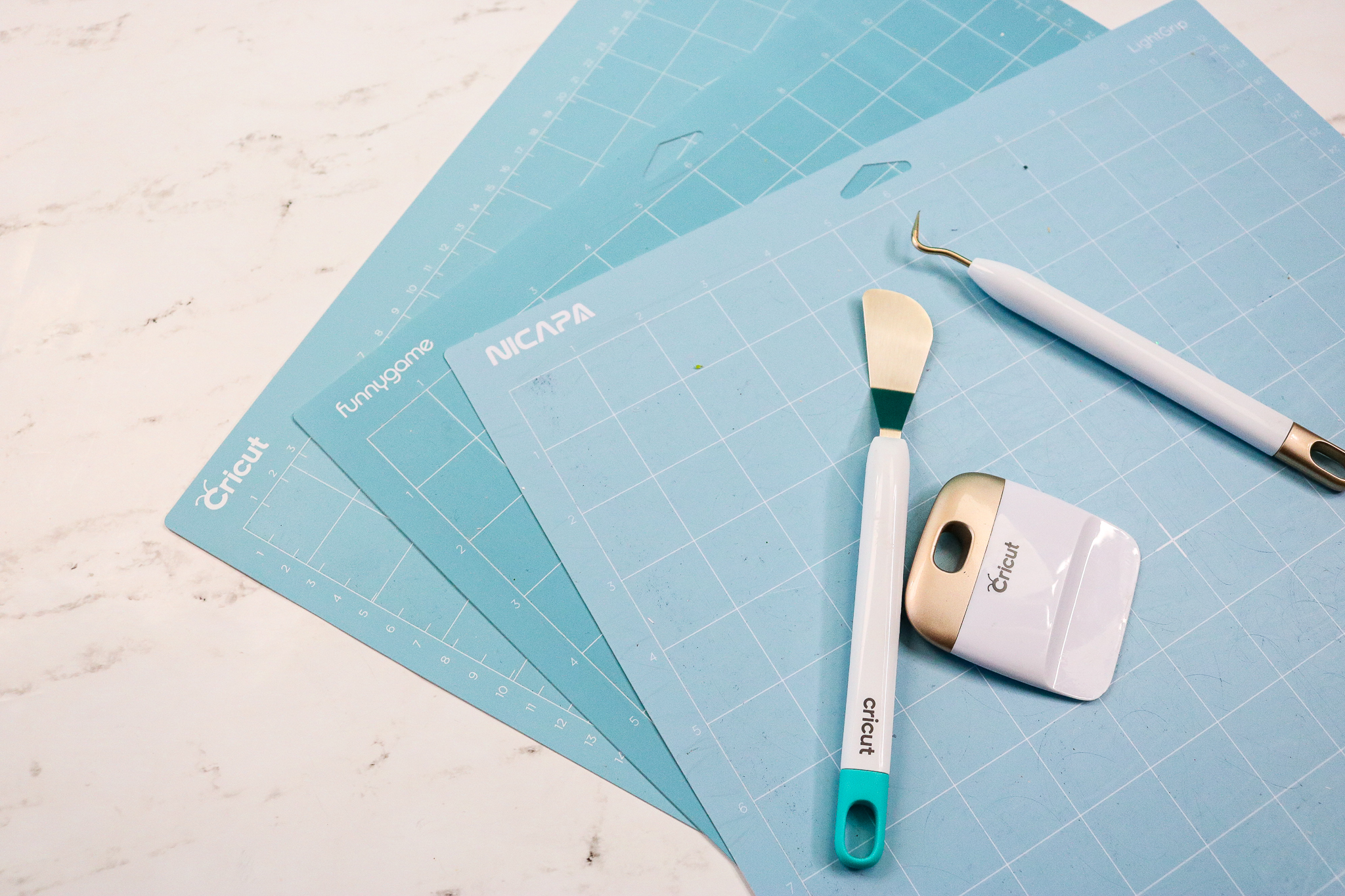 three brands of Cricut Mats