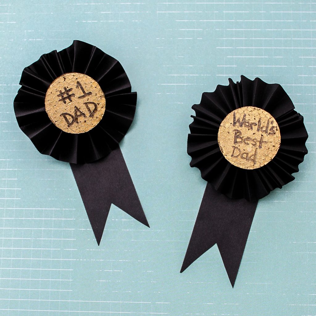 These Father's Day medals are a great craft for kids to help make for Dad. Turn the kids loose on the painting and text while you fold the ribbon and add a pin. Dad will be proud to wear these medals on his big day! Father's day medals
