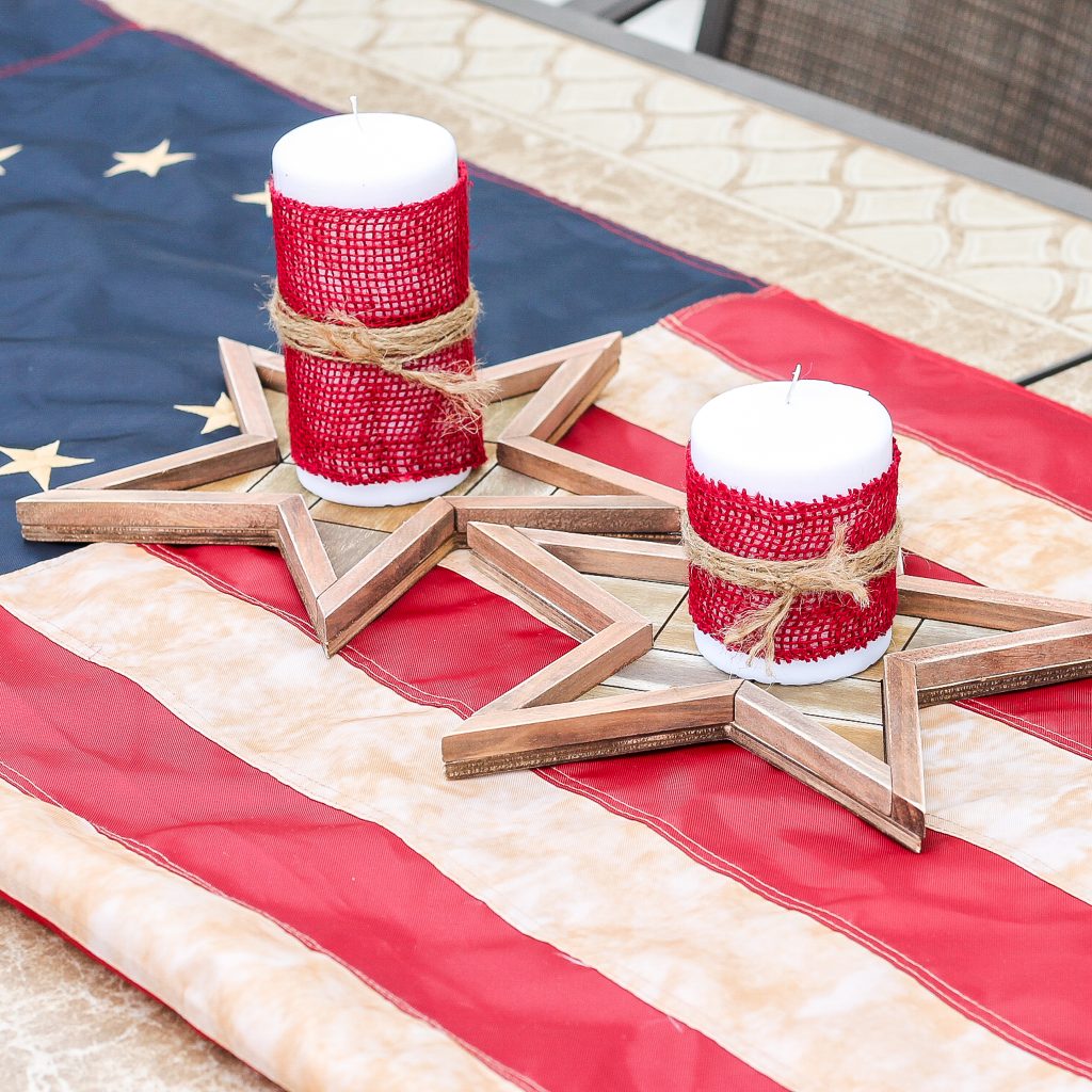 burlap covered candles on American flag