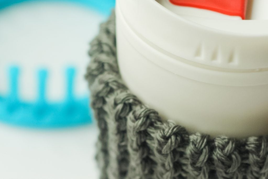 Top of knit sleeve for coffee cup