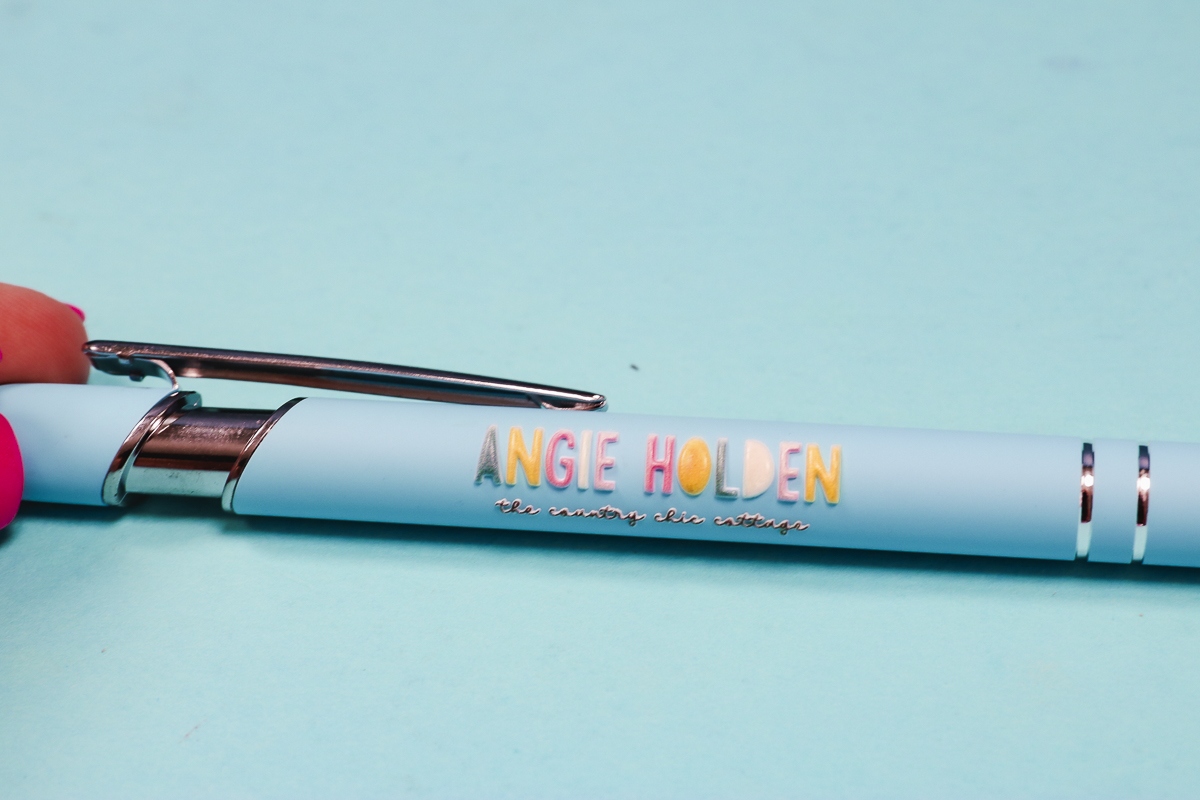 Blue pen with 3D raised print.