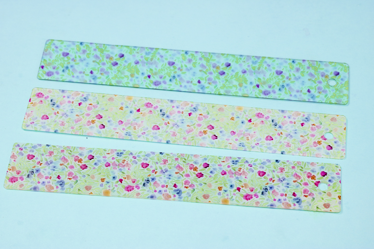 Comparing acrylic bookmarks.