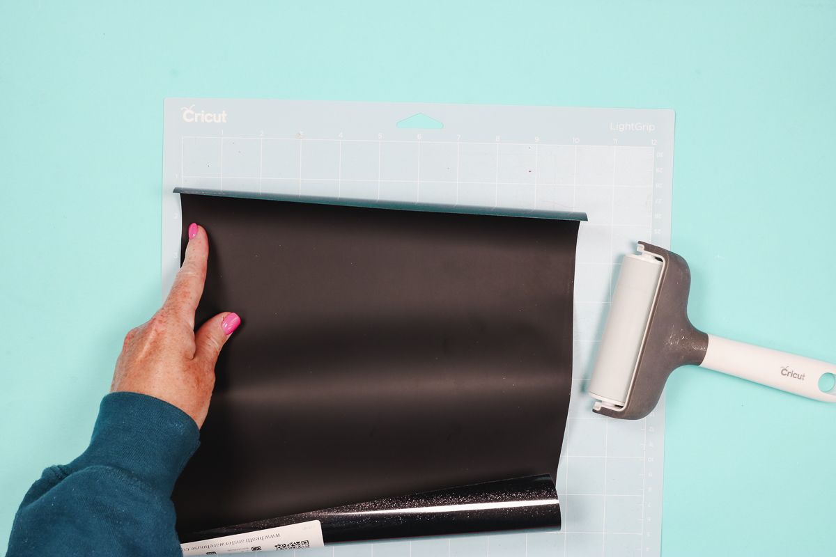 Add HTV to cutting mat.