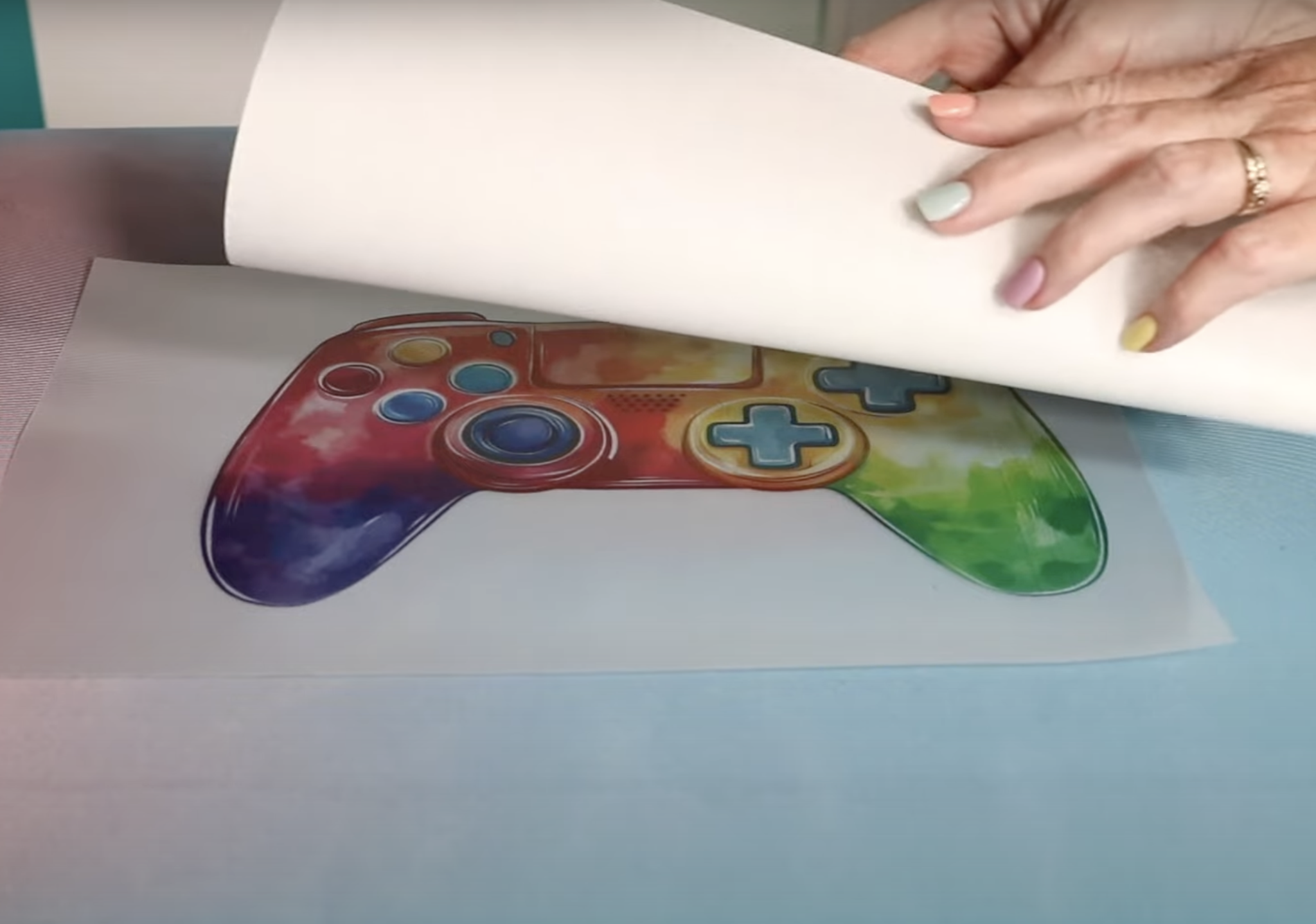 Add glitter adhesive sheet to clear toner print.