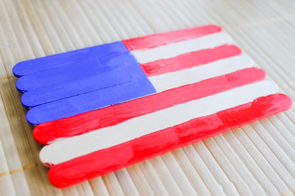 Painting popsicle sticks to look like an American flag