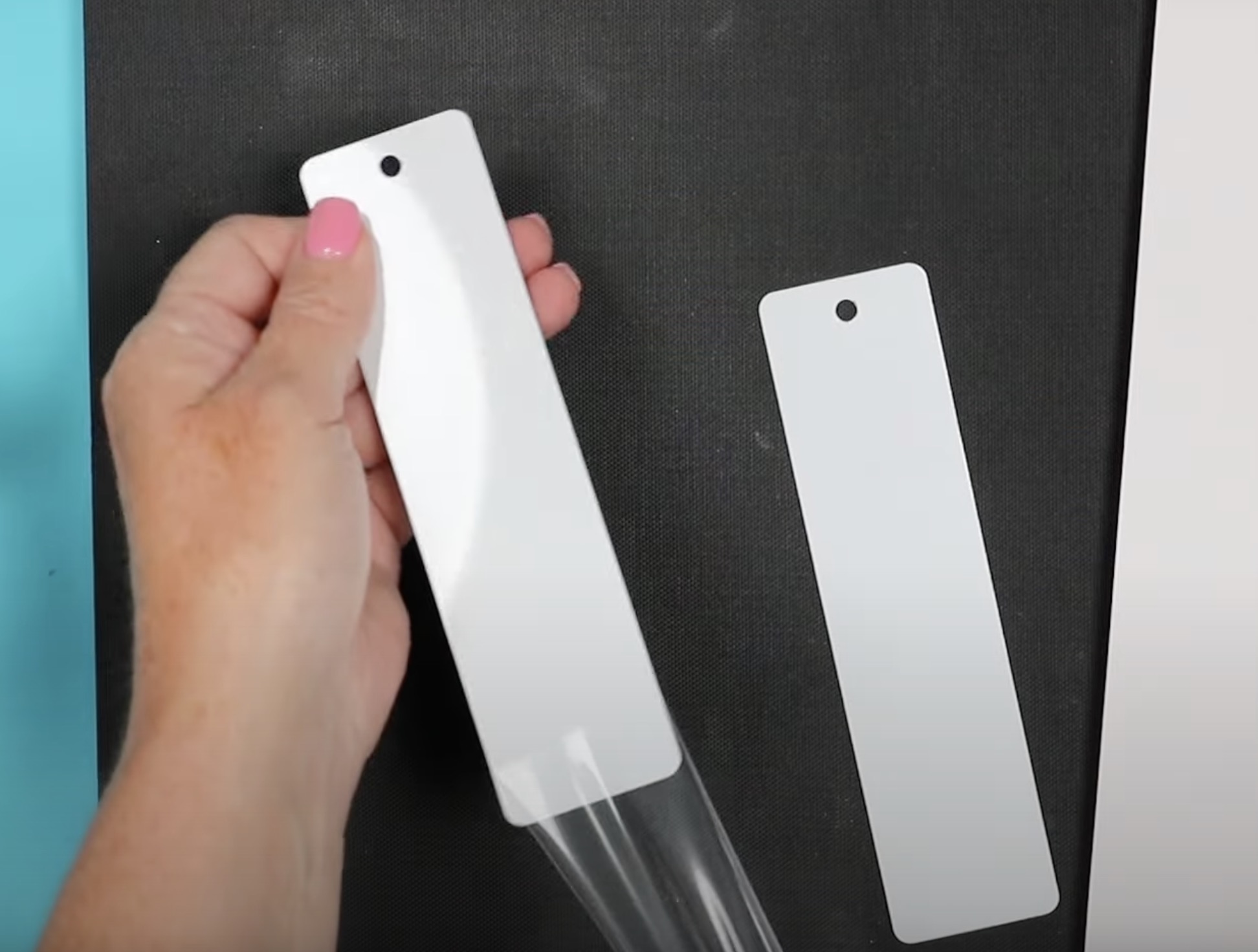 Remove protective covering from sublimation bookmark.