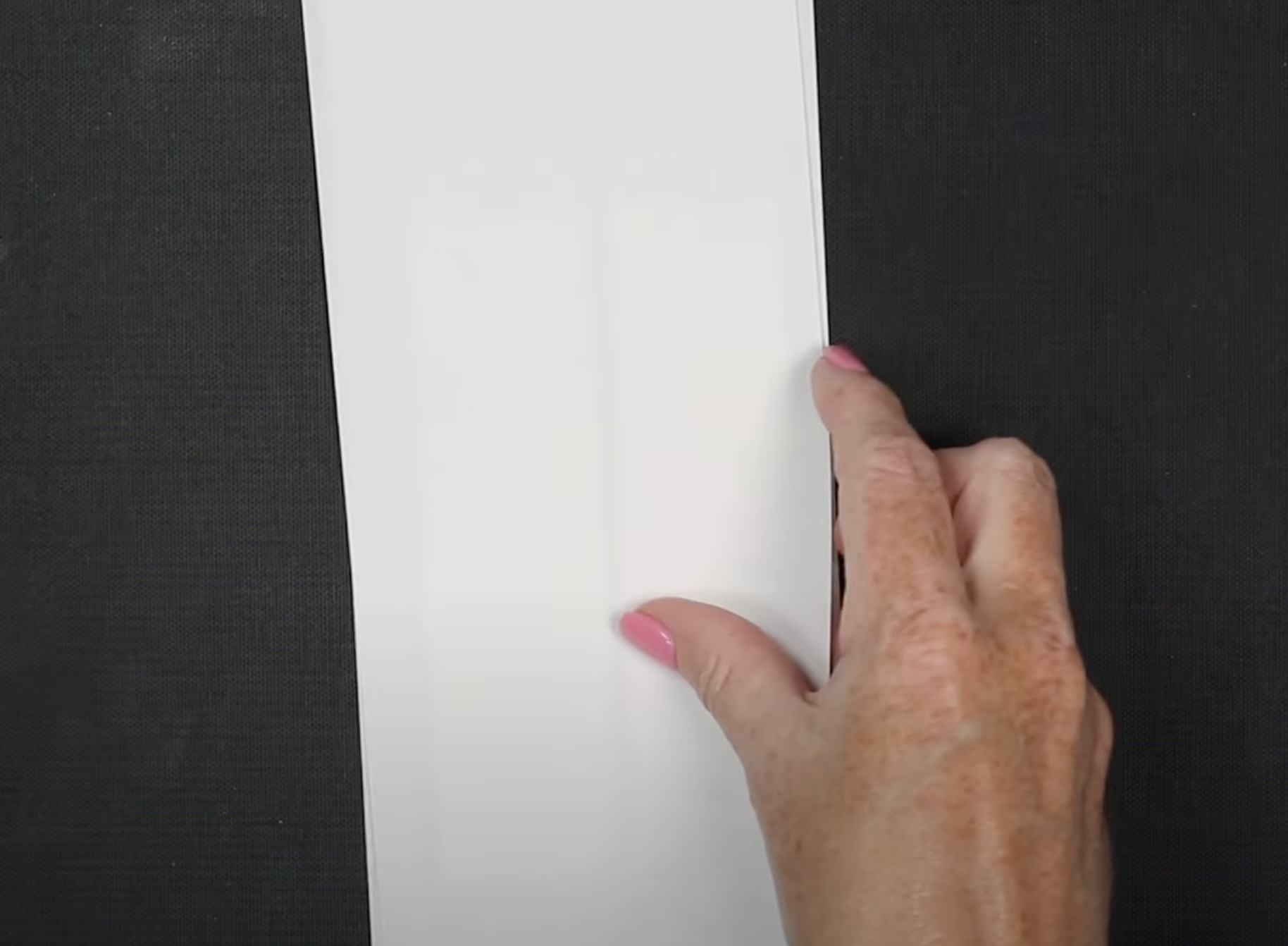 Cover bookmark with protective paper.