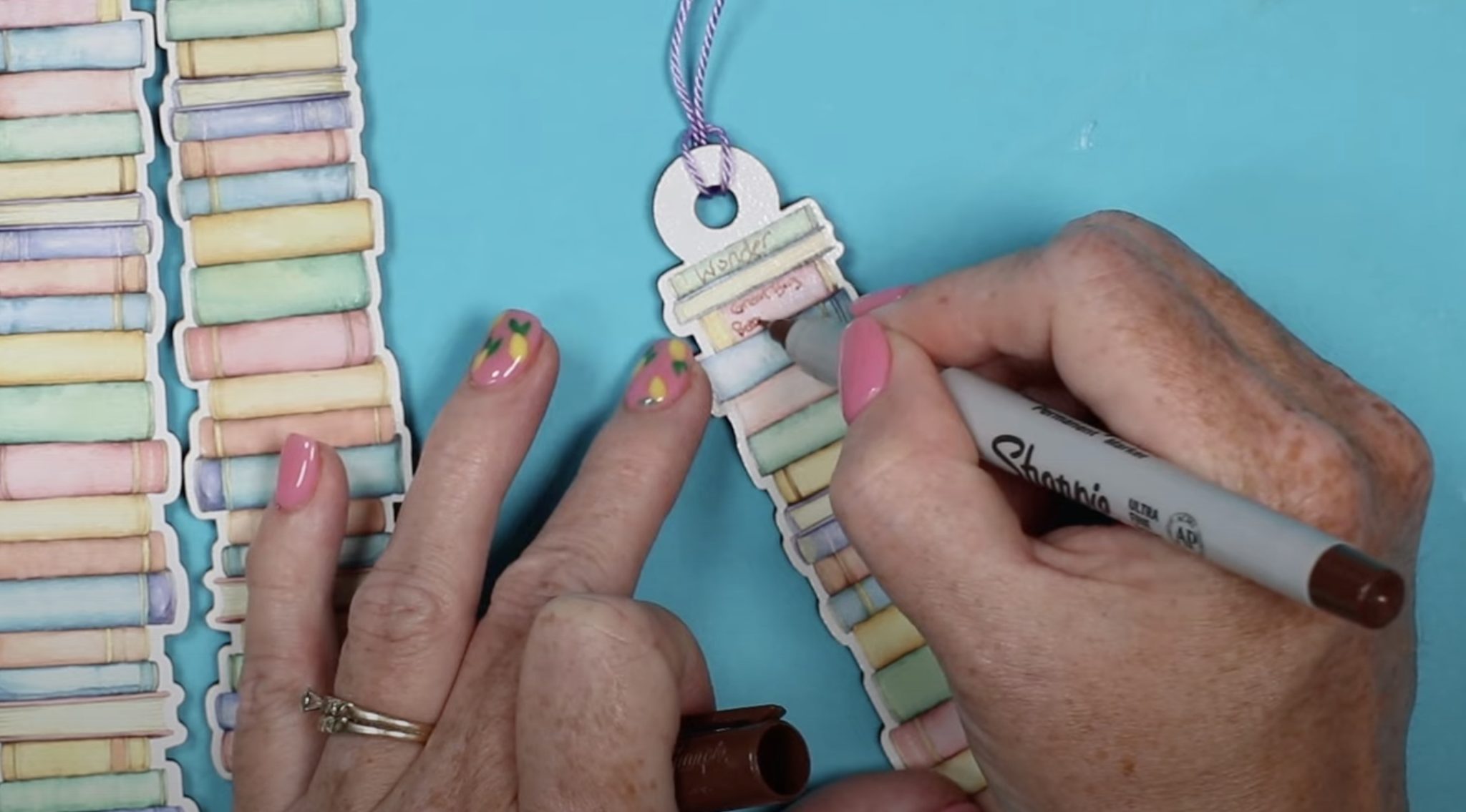 Use a fine-line Sharpie to write on bookmark.