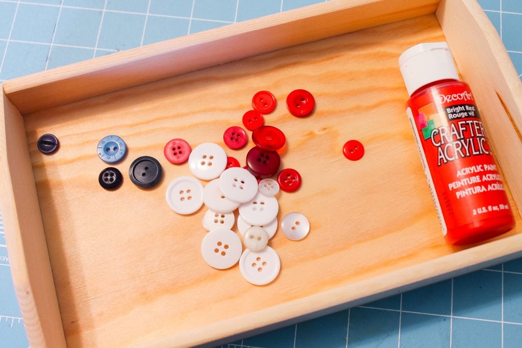 wooden tray with buttons and craft paint