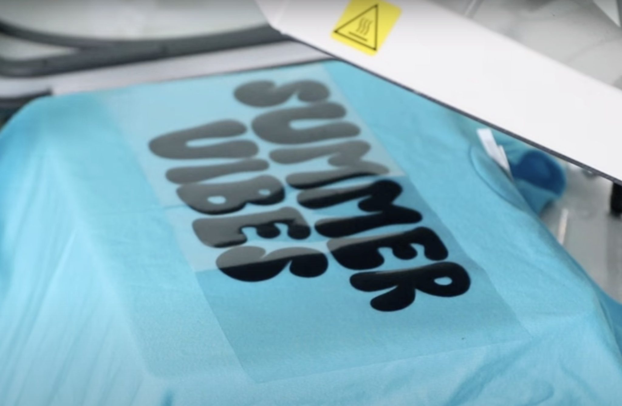 Locate HTV on preheated shirt.