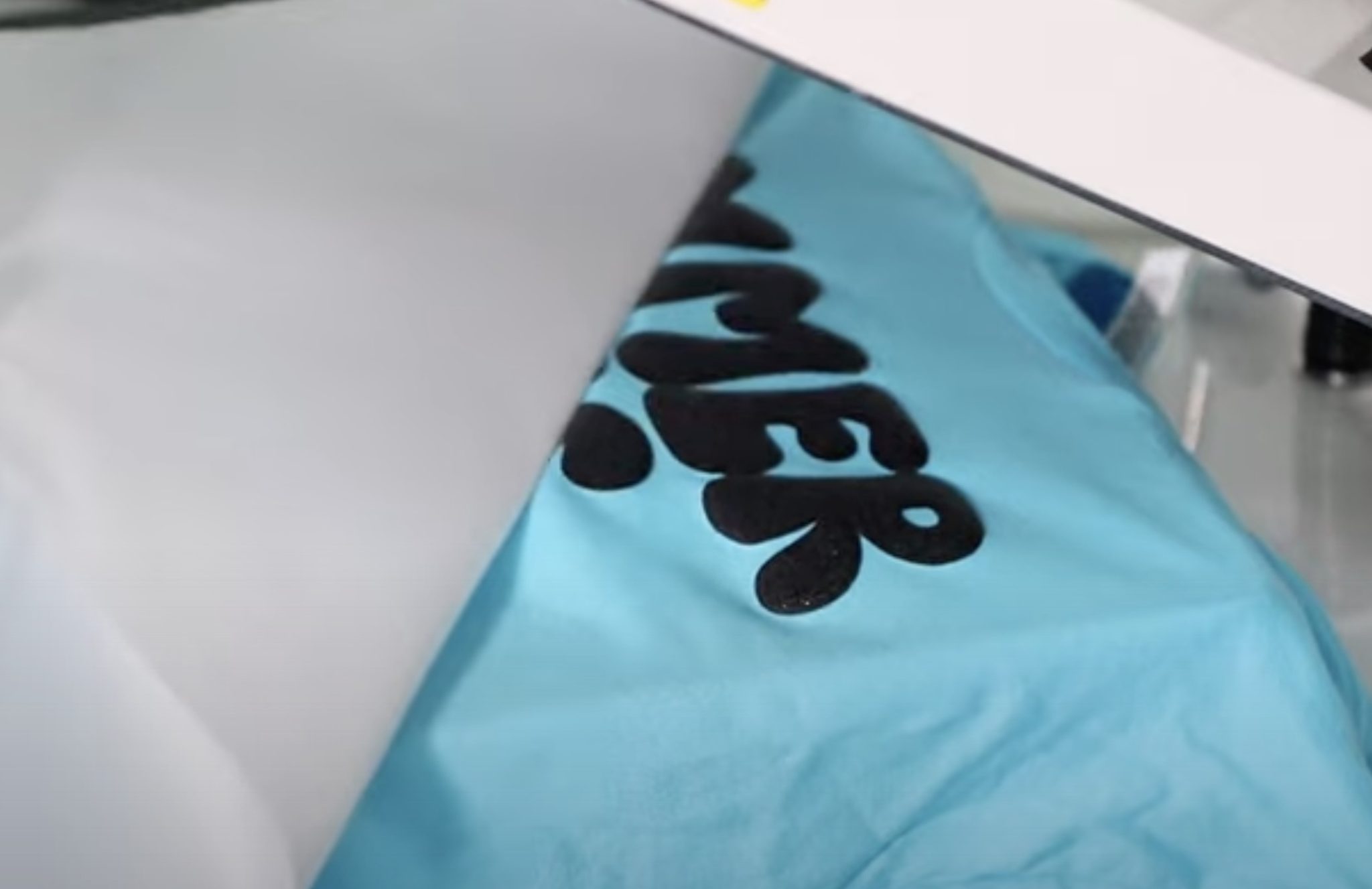 Peel back Teflon sheet while HTV is hot.