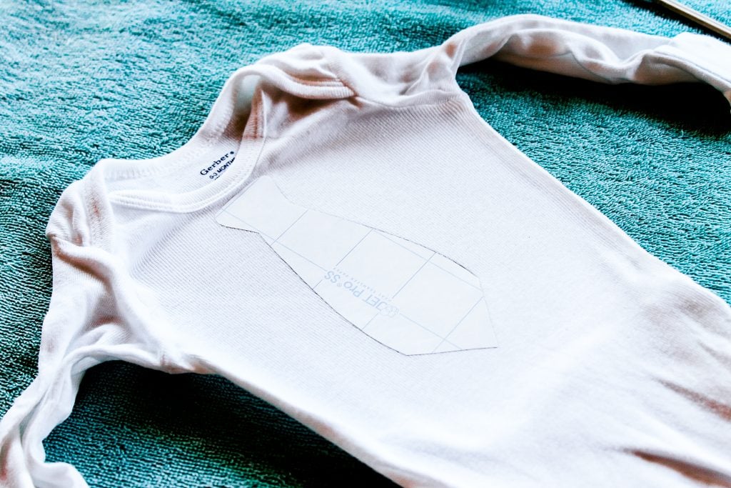 printable vinyl face down on a onesie