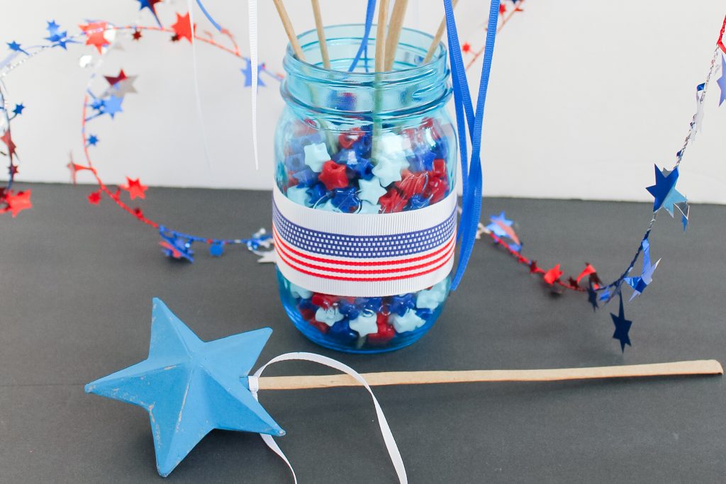 Star-shaped beads in blue mason jar
