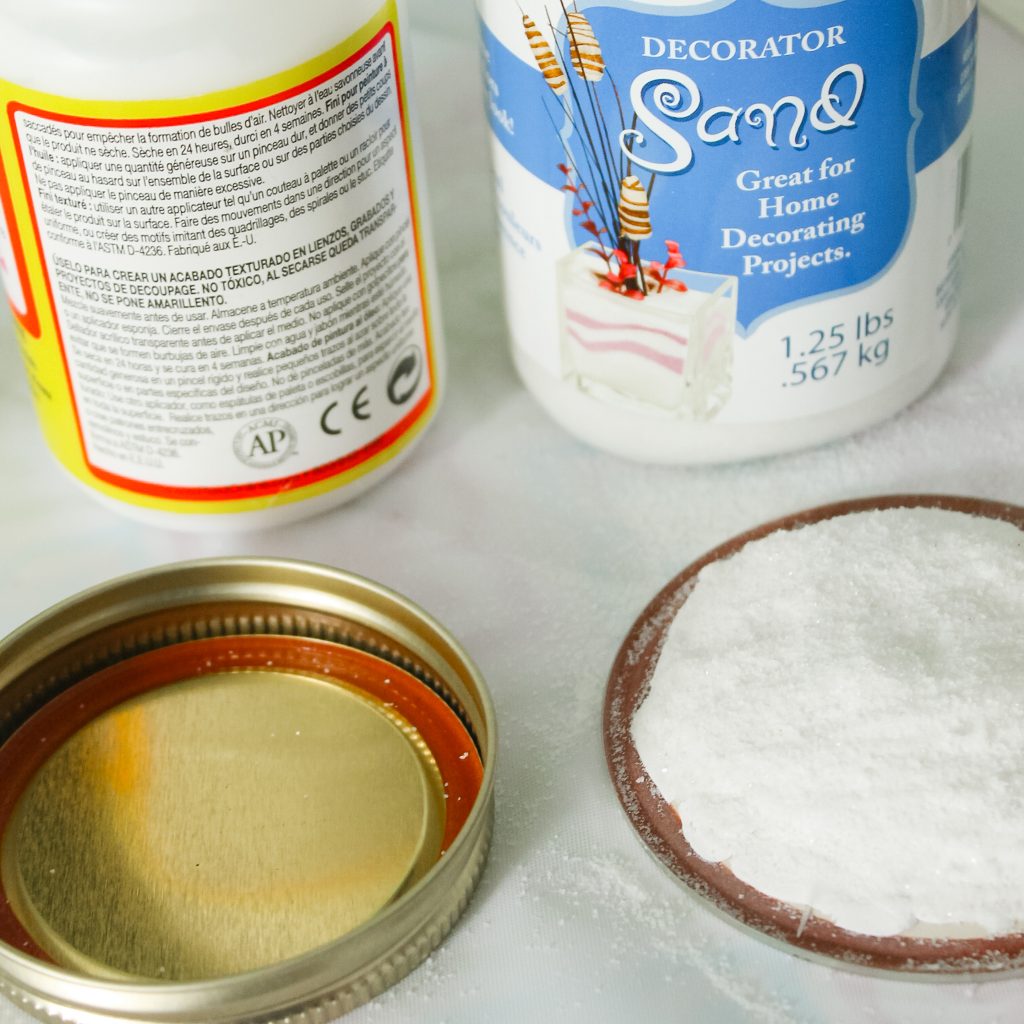 Adding decoupage medium to jar lid