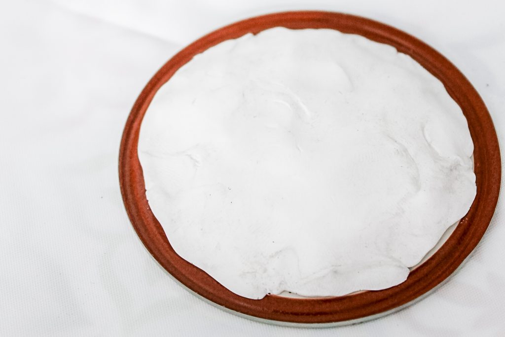 clay on a mason jar lid