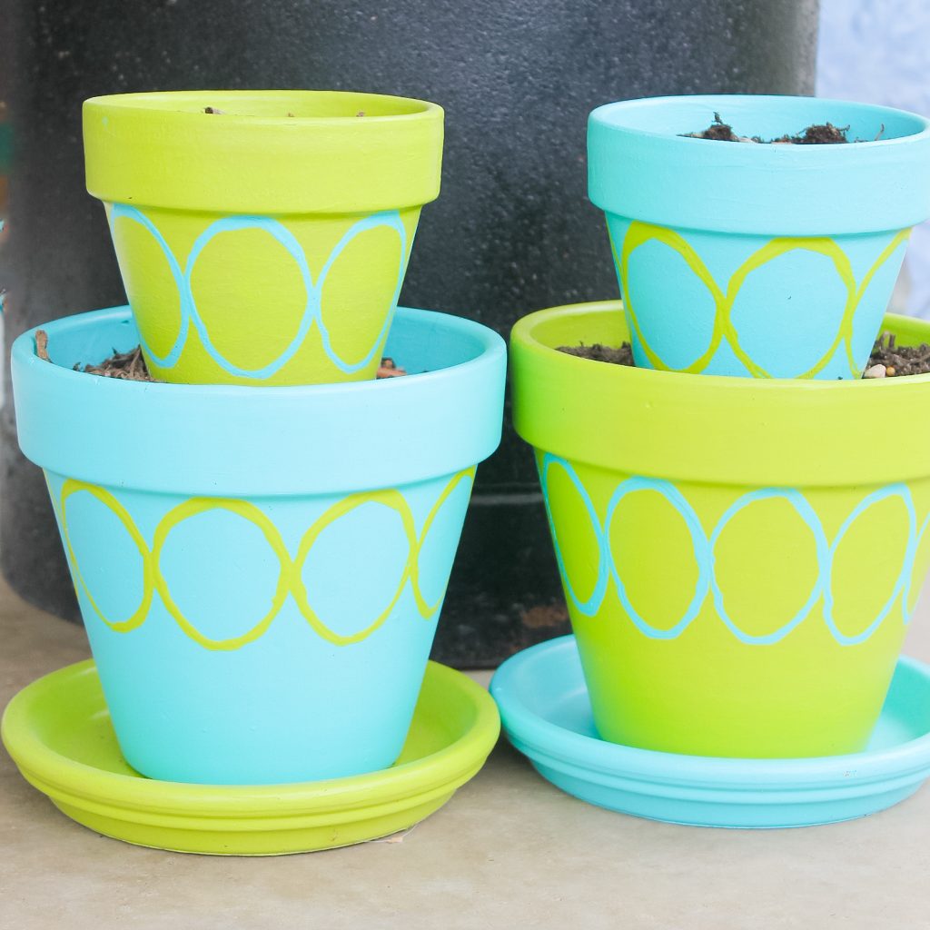 tiered painted pots and planters