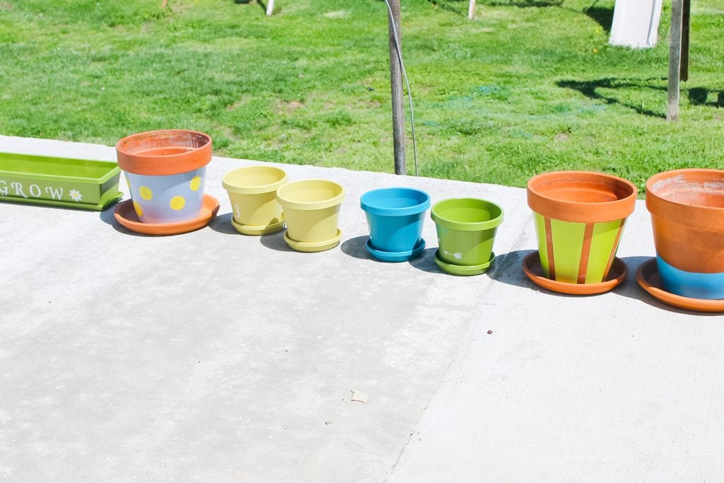 planters drying in the sun after painting