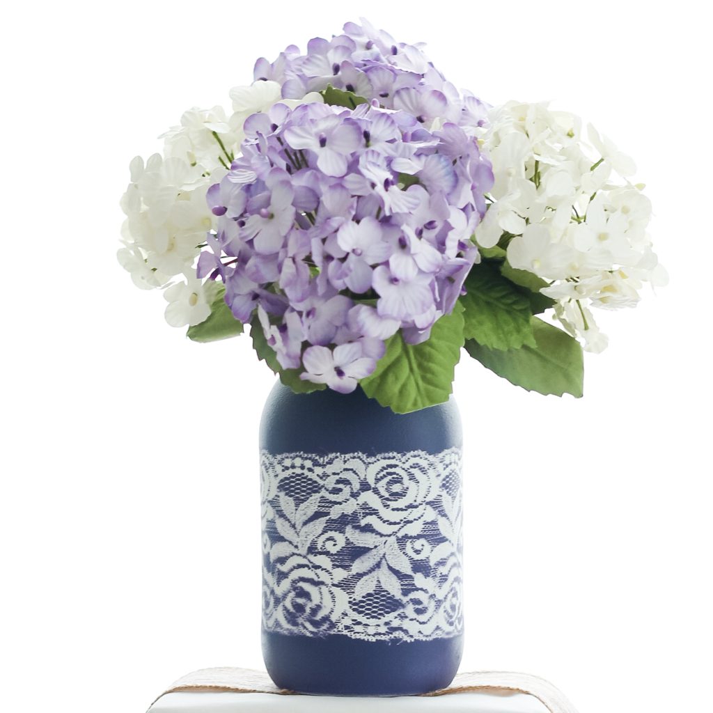 hydrangeas in a painted mason jar vase