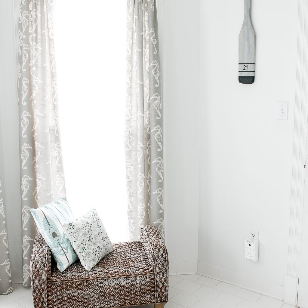 oar hanging on wall by windows