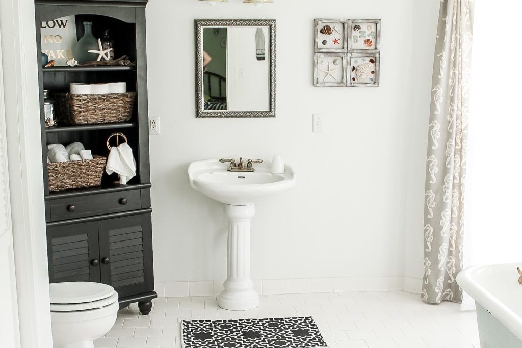 shell frames and styled bathroom cabinet