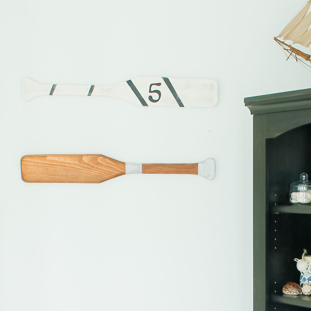 Finished oars on bathroom wall for nautical decor