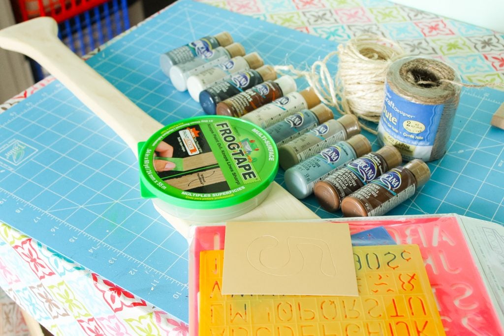 twine, frog tape, paint and stencils on a table