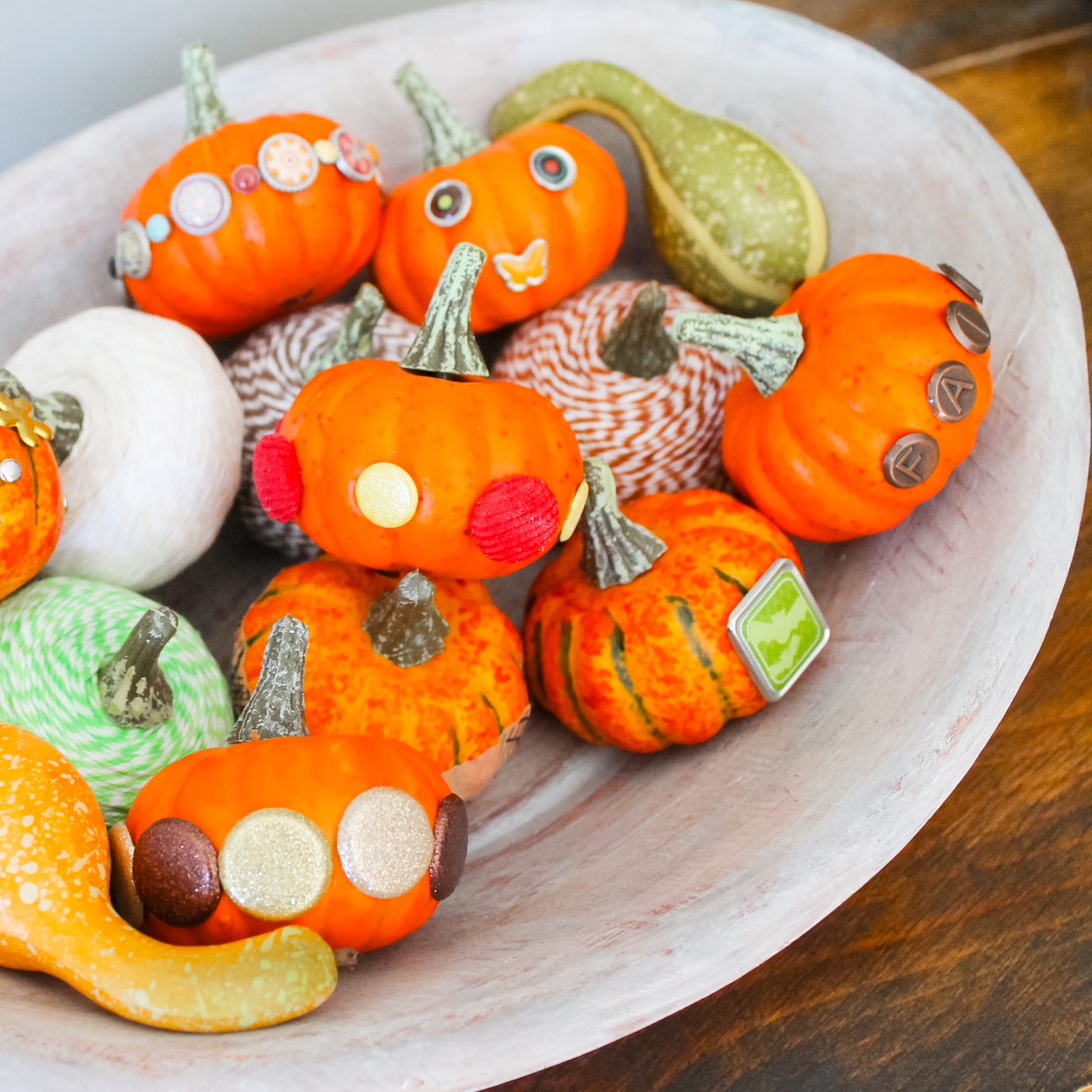 Decorate Small Pumpkins with Craft Brads on a no-carve pumpkin