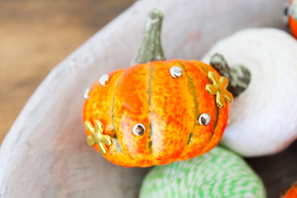 Bradded Pumpkins -- a 5 minute way to update fake or real pumpkins. Just insert brads by pushing! So simple! Click to see a variety of ways to decorate pumpkins with brads. different sized brads on craft pumpkins