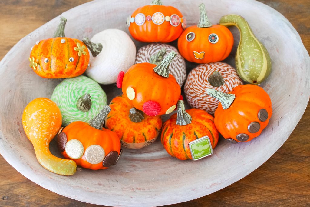 Bradded Pumpkins -- a 5 minute way to update fake or real pumpkins. Just insert brads by pushing! So simple! Click to see a variety of ways to decorate pumpkins with brads. Bowl of embellished pumpkins