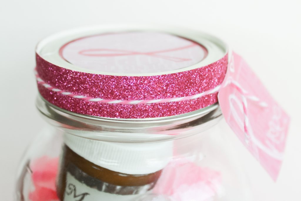 Mason jar lid with giltter ribbon and tag