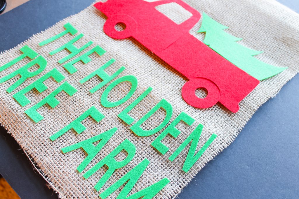 Laying cut felt on a piece of burlap