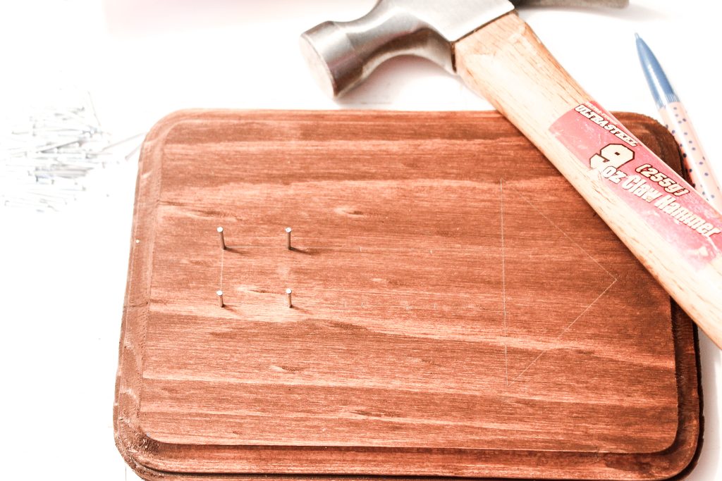 hammerinwood pieceg nails into stained