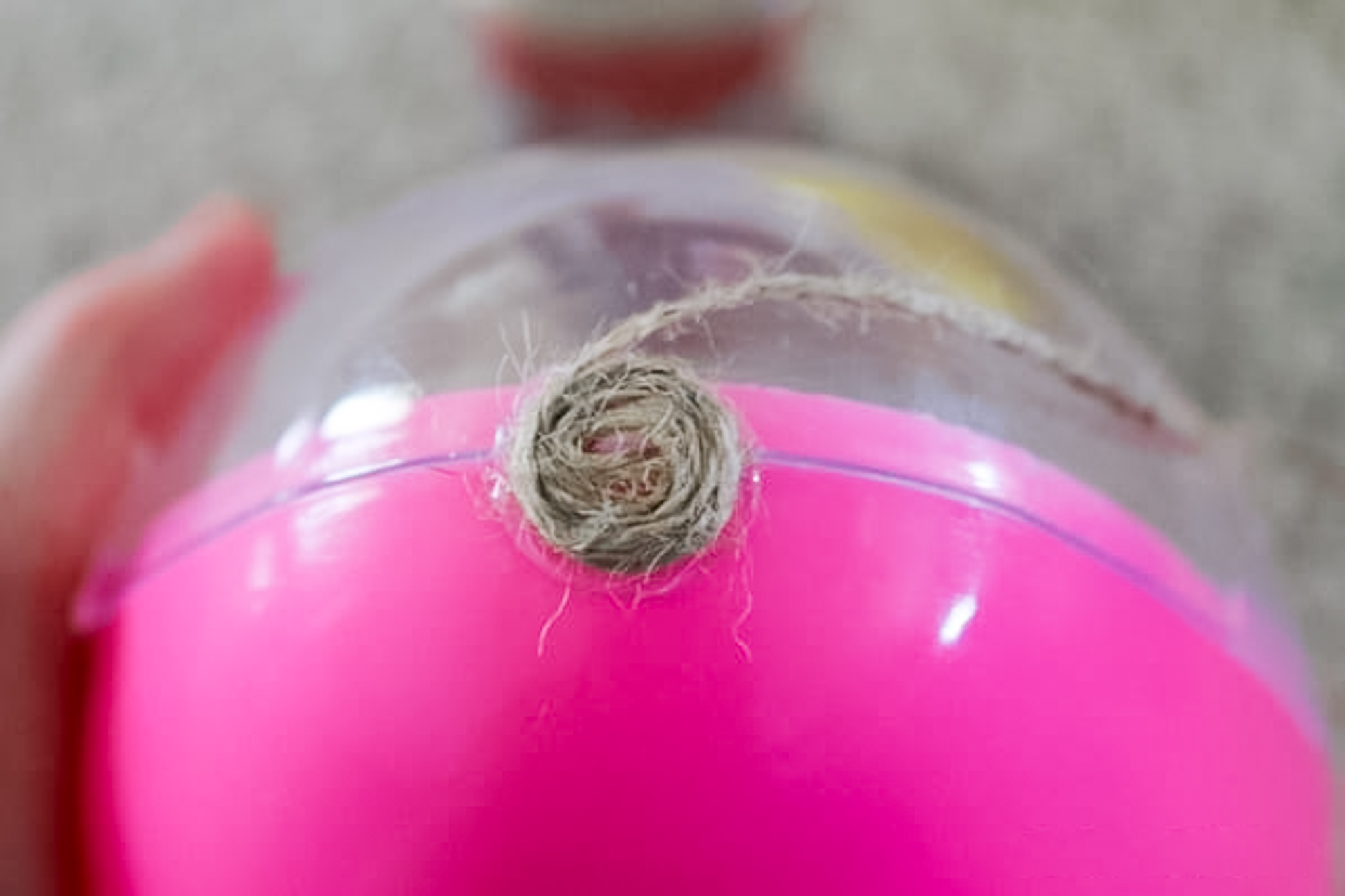 Starting to add twine to the plastic egg