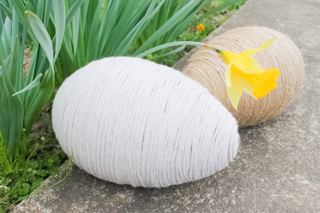 White twine wrapped around a large plastic egg