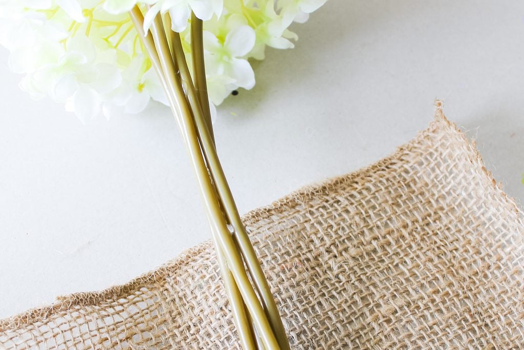 flower stems ready to be wrapped with burlap ribbon
