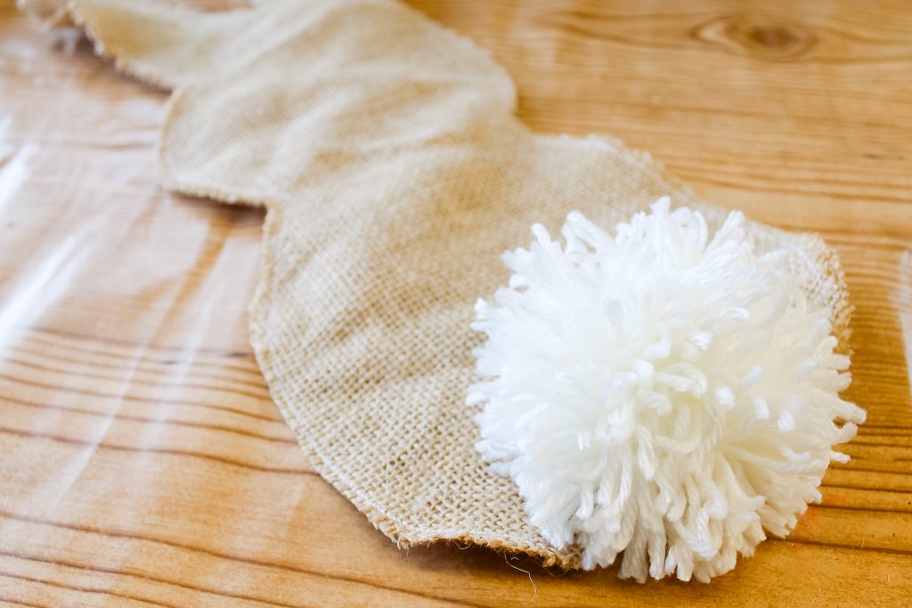 Pompom bunny tail on burlap