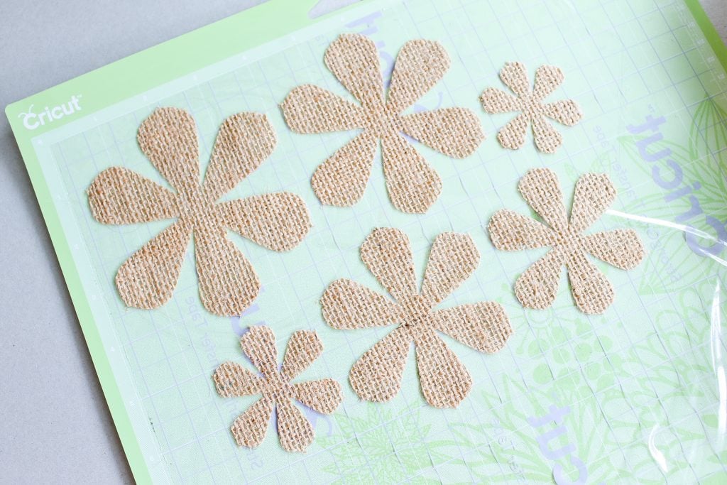 cut pieces of burlap on a cutting mat