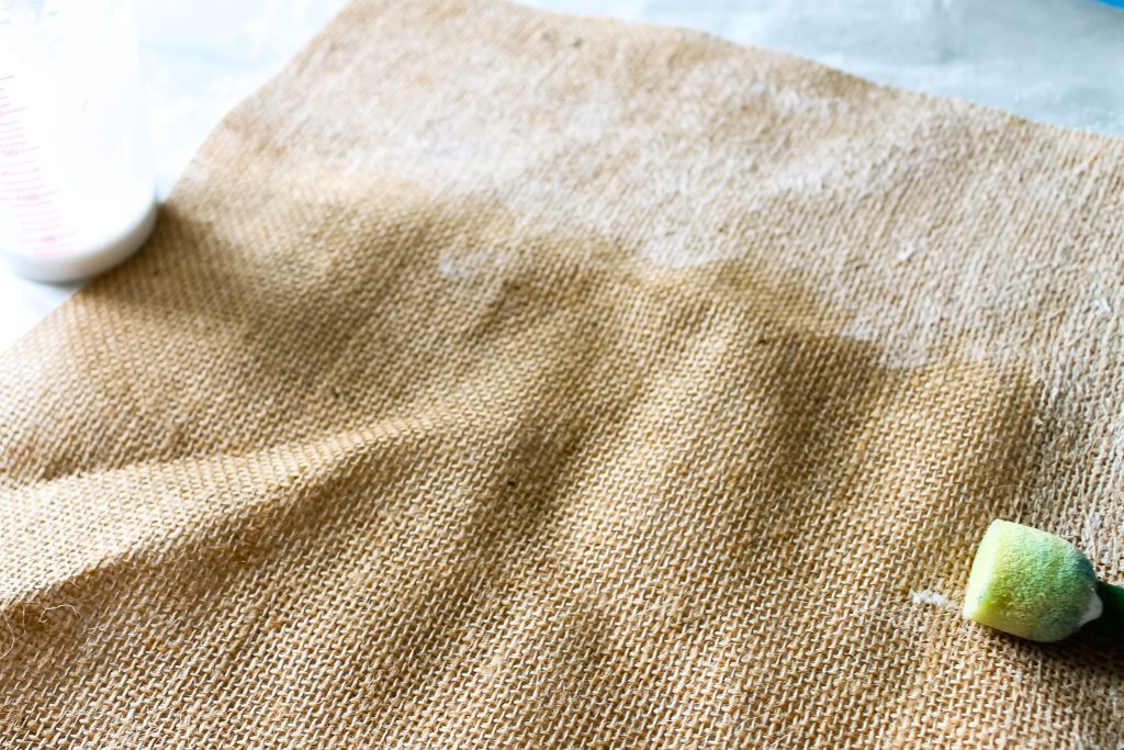 adding stiffener to a piece of burlap using a pouncer brush