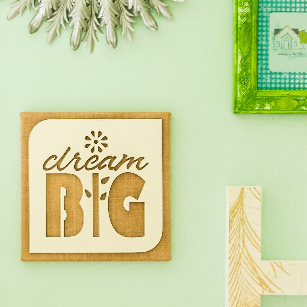 burlap wall art hanging on a wall