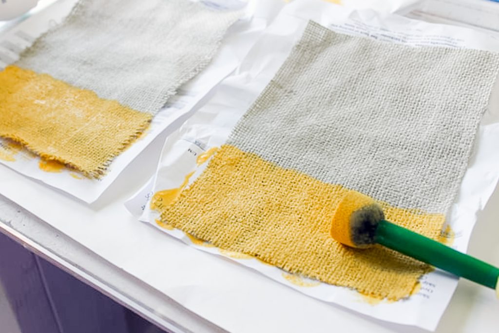 yellow paint on burlap pieces