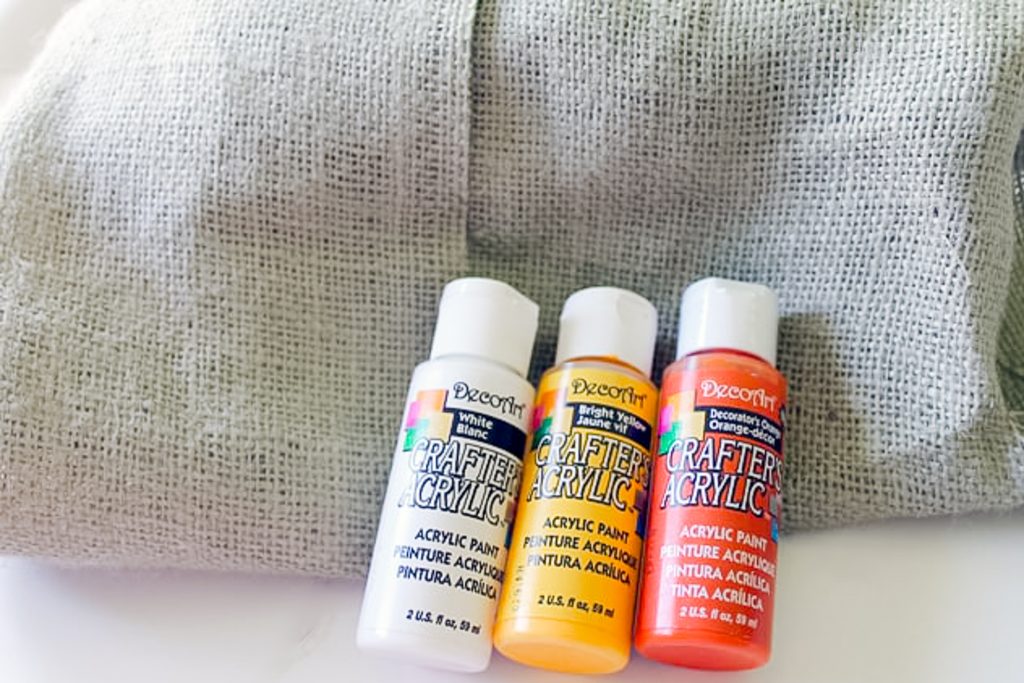 craft paint in orange, yellow, and white