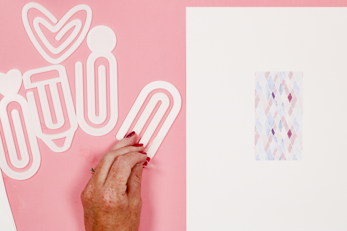 Remove film from sublimation paper clip.