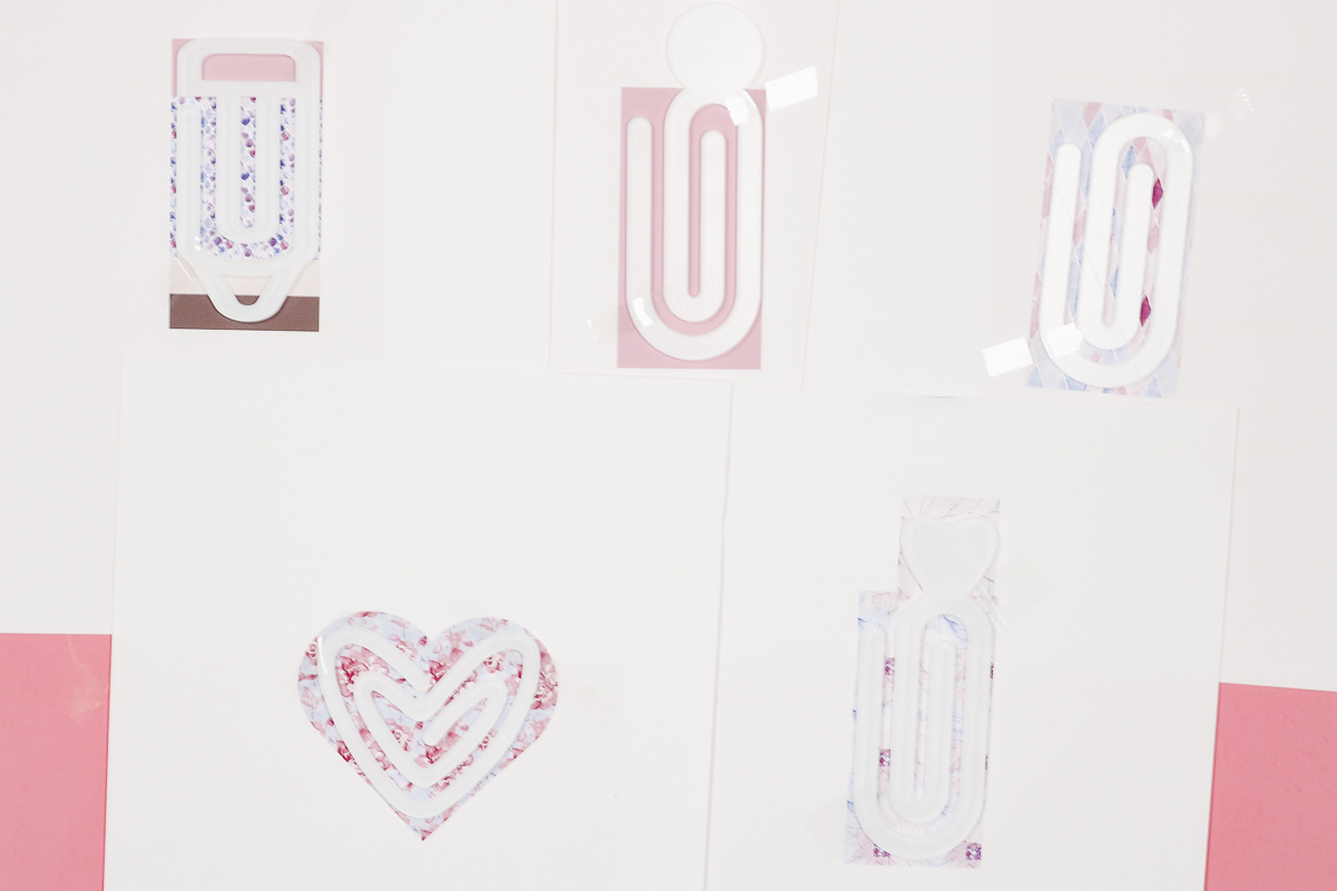 Multiple paper clips on sublimation prints.