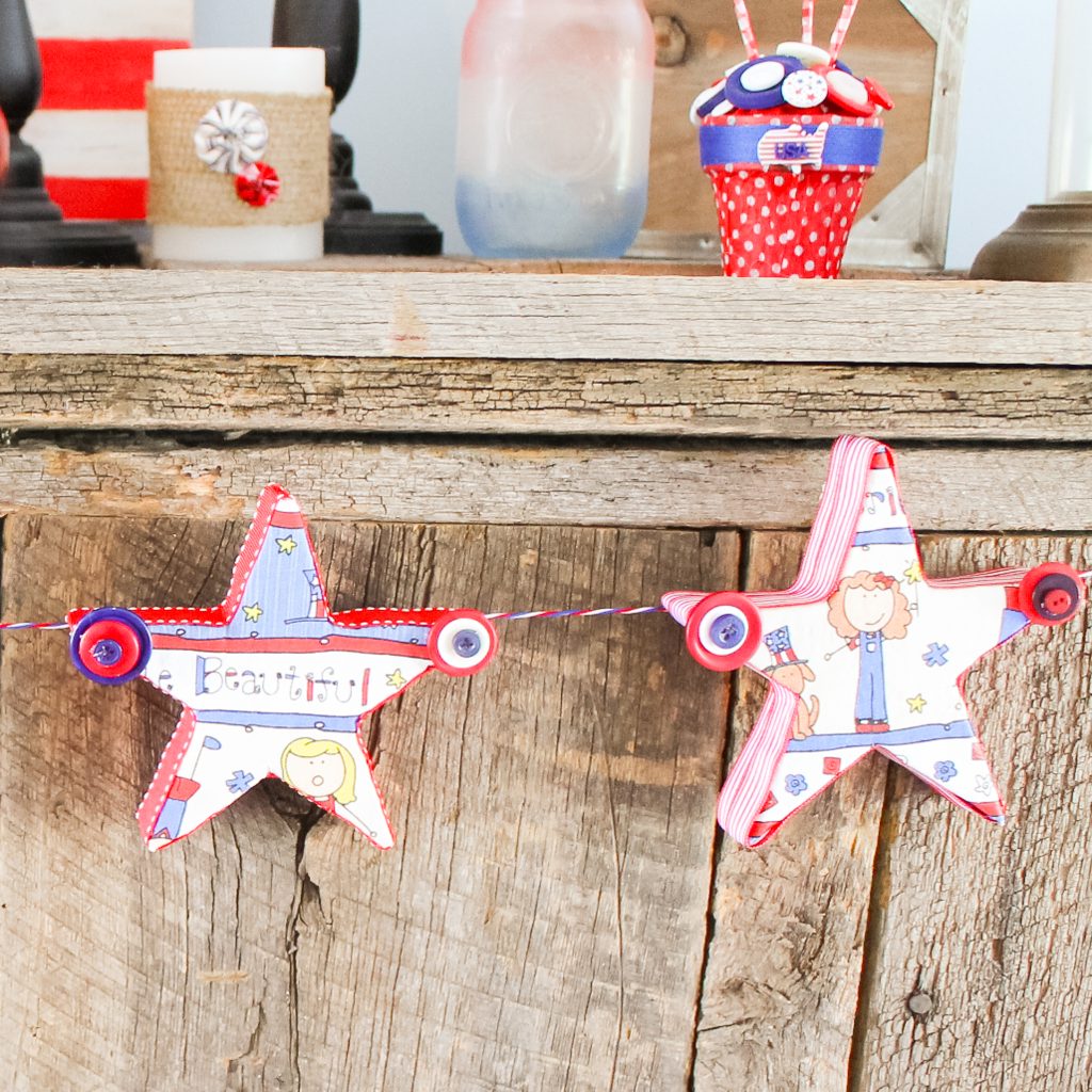 stars and button garland on a mantel